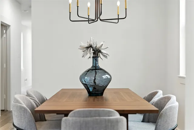 a living room with furniture a chandelier and a window