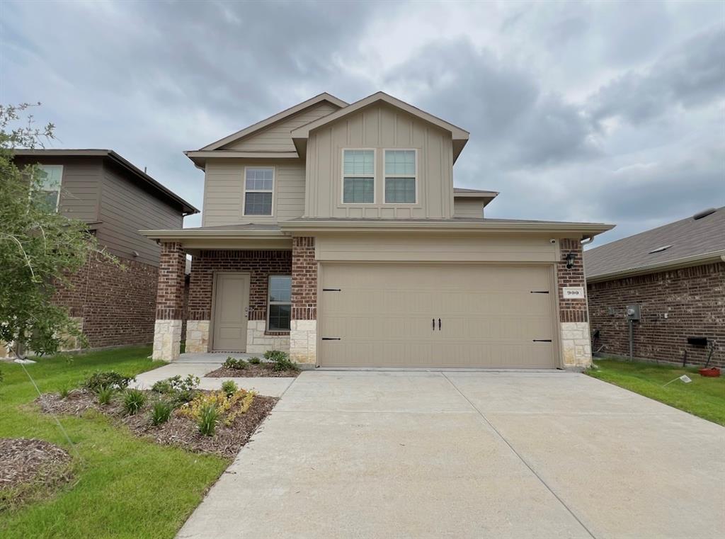 a view of a house with a yard and plants