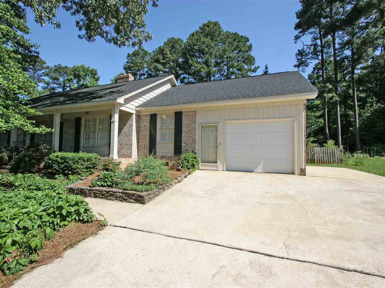 1324 Kingston Ridge Road Cary, NC 27511 - Photo 4 of 30 Oversized 1-car garage has new overhead door. Be sure to check out the storage room in the garage. There is a parking pad to the side, as well as plenty of driveway parking space for family and friends. Garage