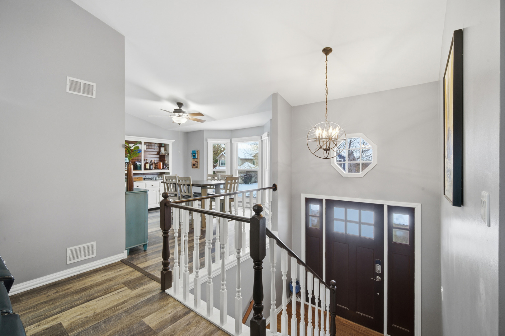 1032 Oak Tree Trail Lake Villa, IL 60046 - Photo 11 of 23 a view of a hallway with wooden floor and staircase