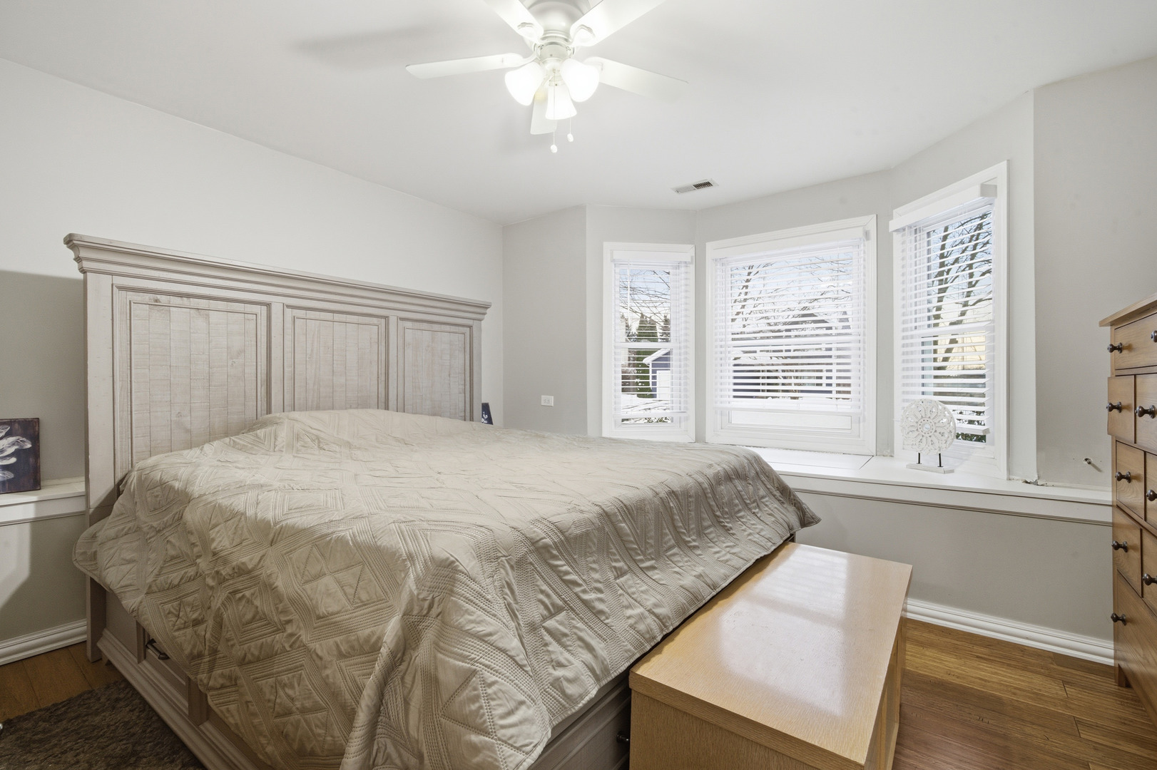 1032 Oak Tree Trail Lake Villa, IL 60046 - Photo 14 of 23 a bedroom with a large bed and a window