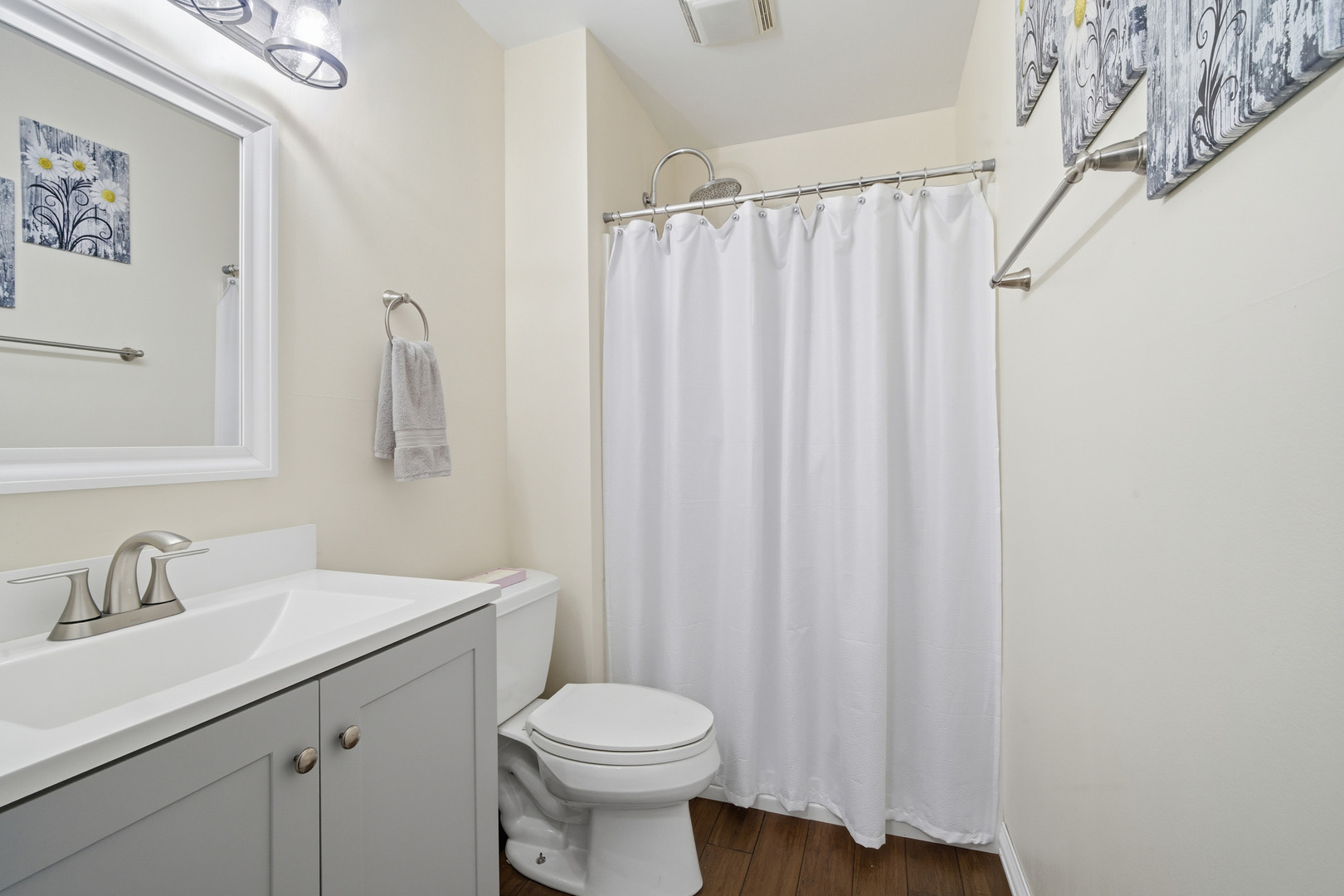 1032 Oak Tree Trail Lake Villa, IL 60046 - Photo 17 of 23 a bathroom with a sink a toilet and shower curtain