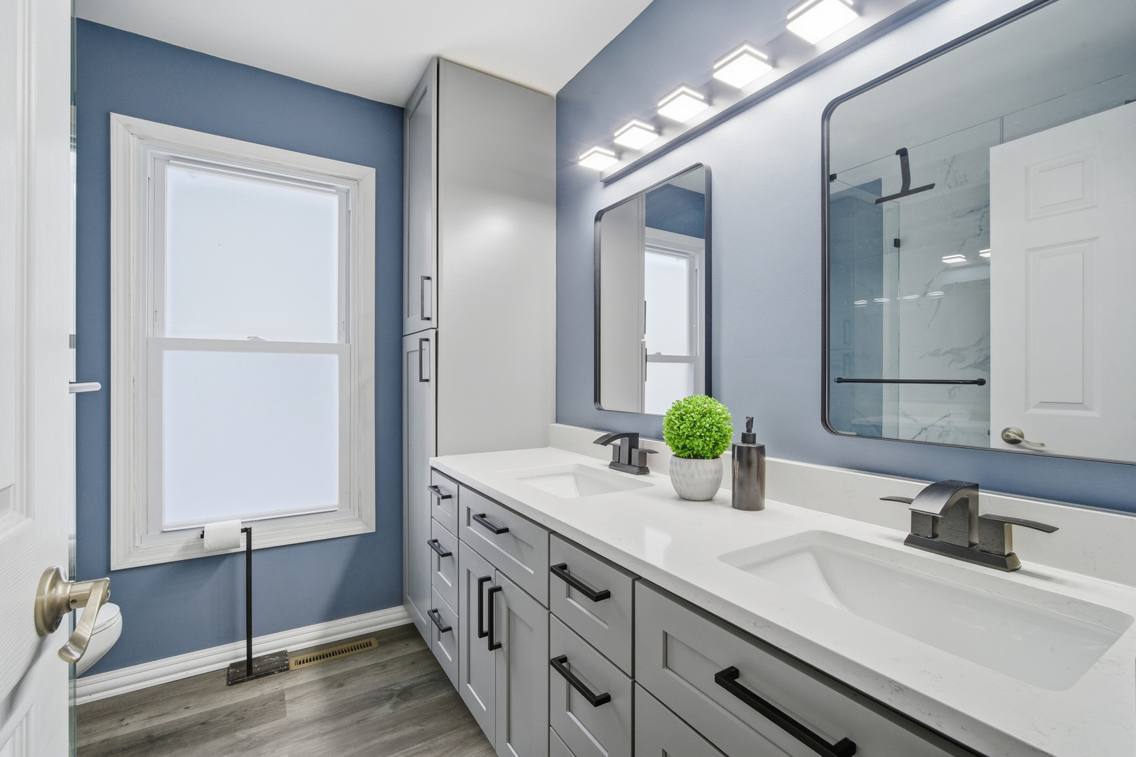 1032 Oak Tree Trail Lake Villa, IL 60046 - Photo 18 of 23 a bathroom with a double vanity sink and a mirror