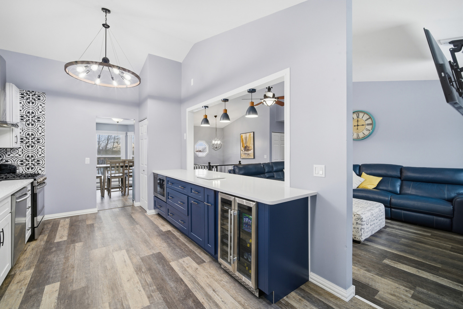 1032 Oak Tree Trail Lake Villa, IL 60046 - Photo 2 of 23 a large kitchen with stainless steel appliances wooden floor and large windows