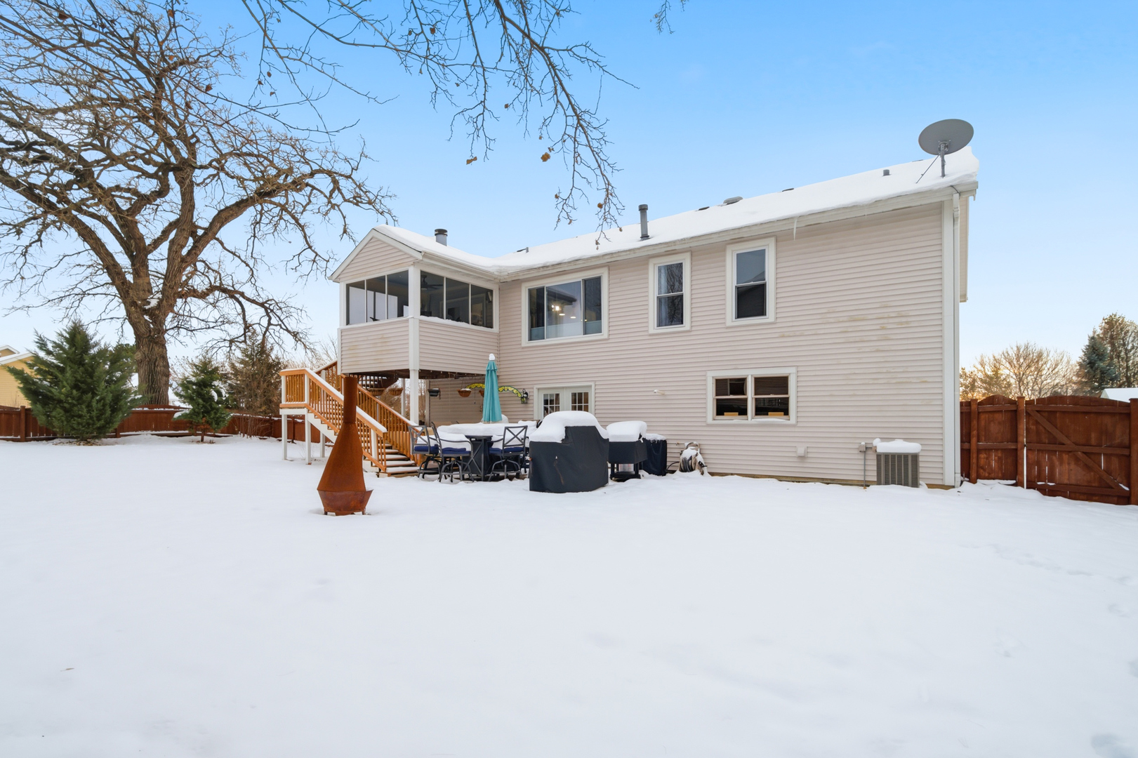1032 Oak Tree Trail Lake Villa, IL 60046 - Photo 22 of 23 a view of a house with a yard covered in snow