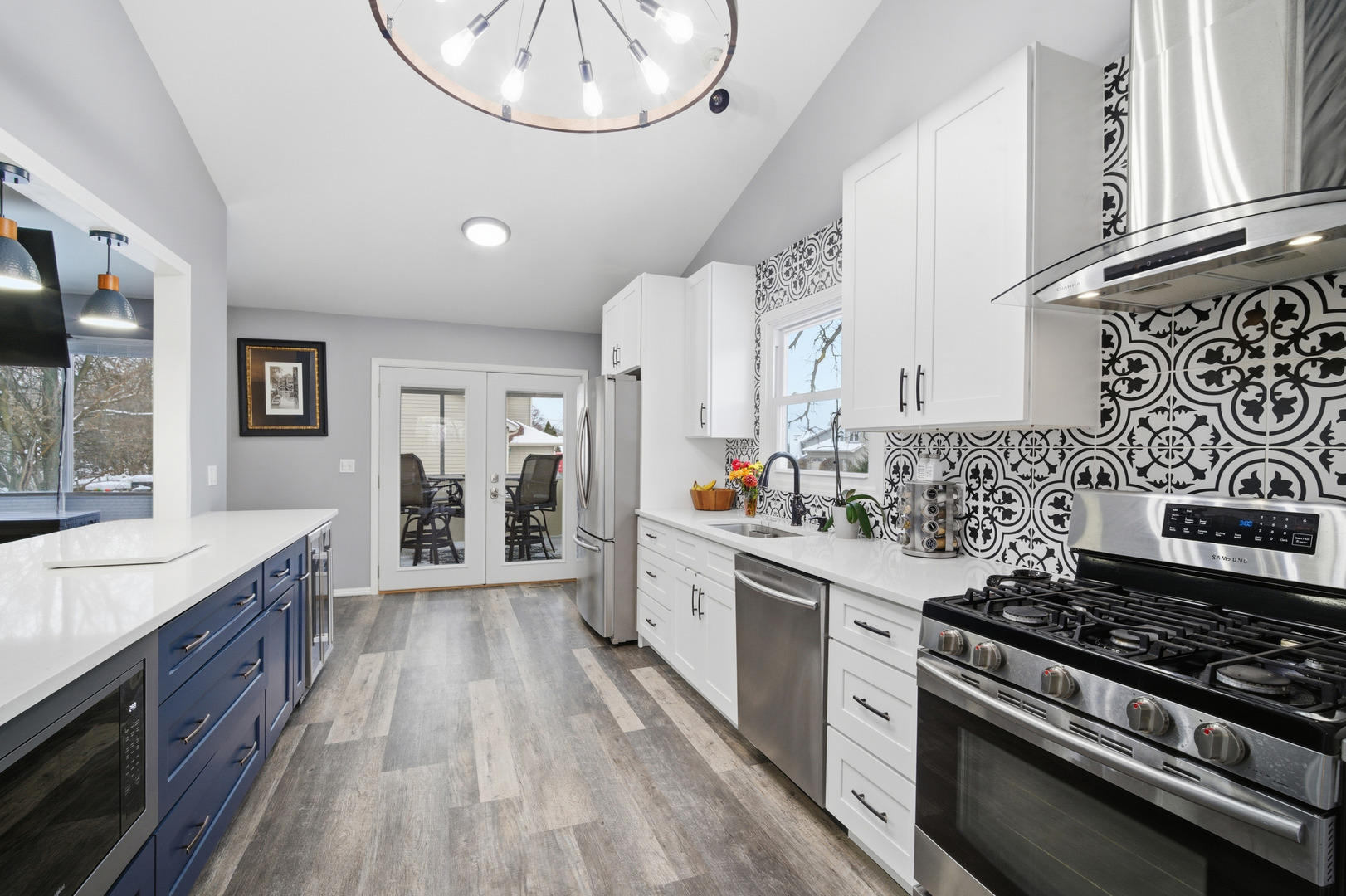 1032 Oak Tree Trail Lake Villa, IL 60046 - Photo 6 of 23 a large white kitchen with a stove and a sink