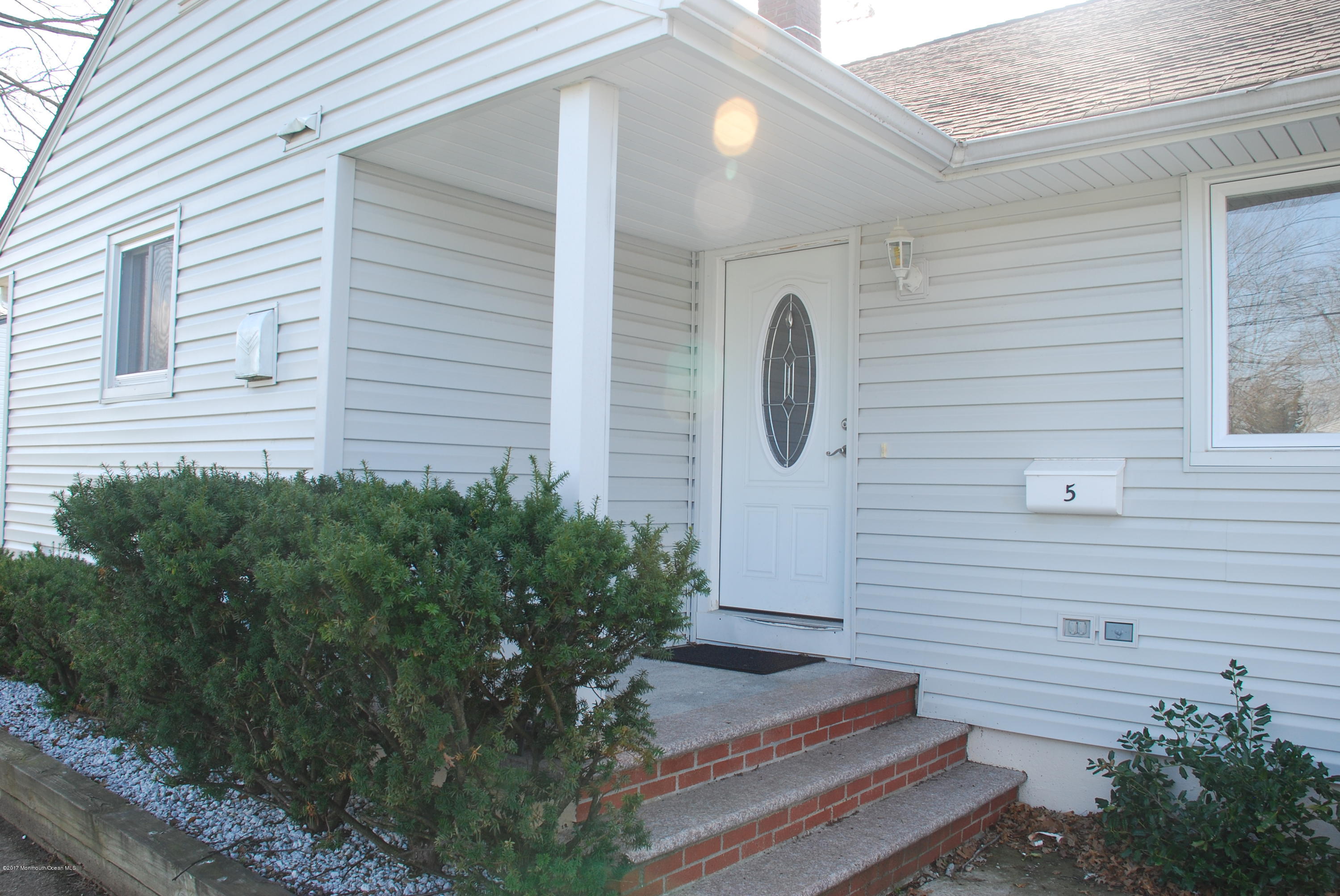 5 Fairmount Road Holmdel, NJ 07733 - Photo 3 of 19 a front view of a house with plants