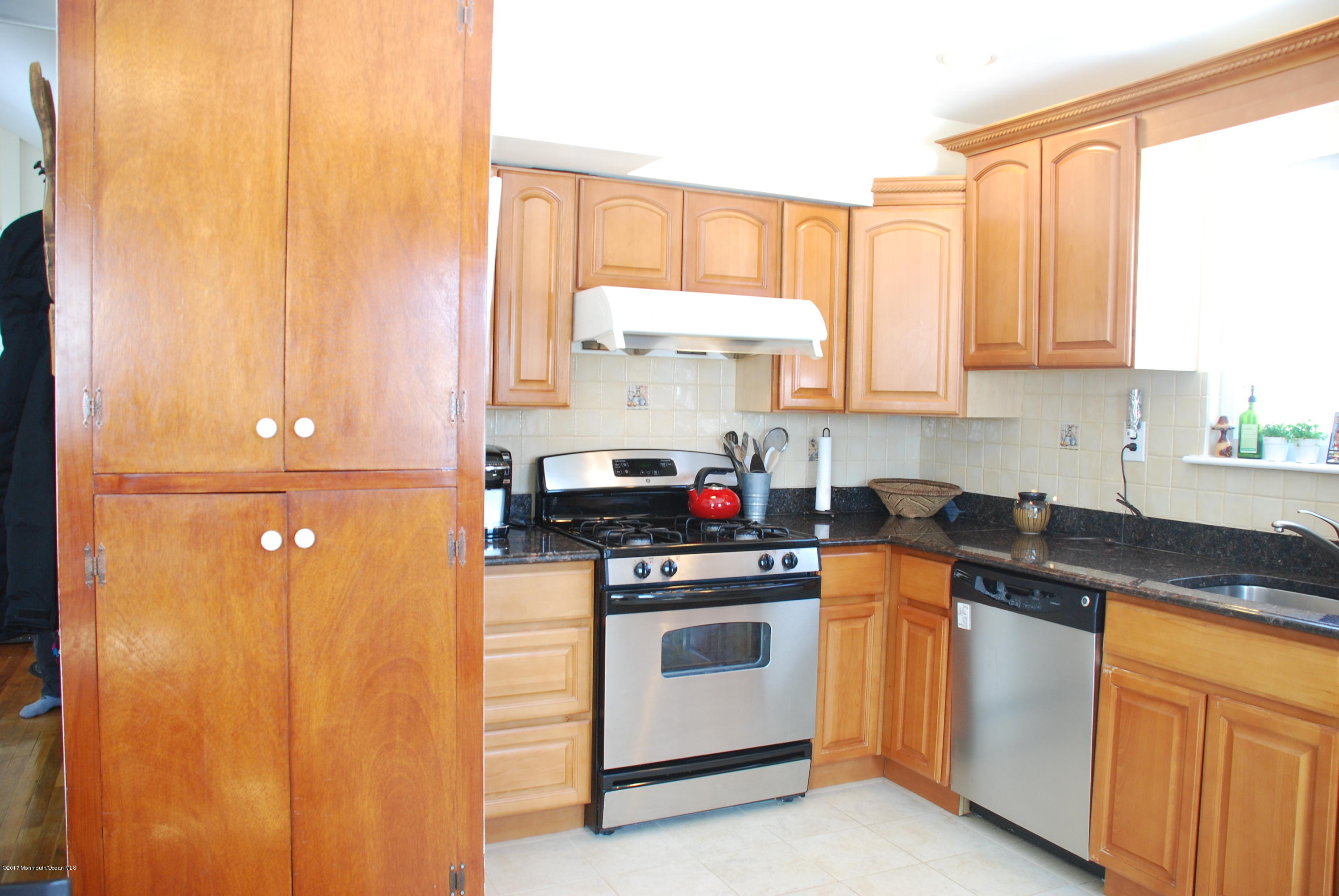 5 Fairmount Road Holmdel, NJ 07733 - Photo 9 of 19 a kitchen with a stove a sink and a window