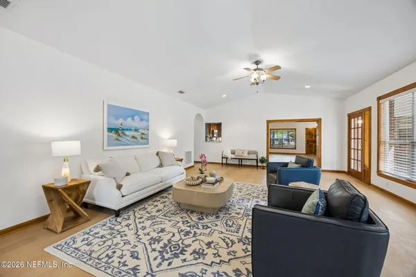 a living room with furniture and a rug