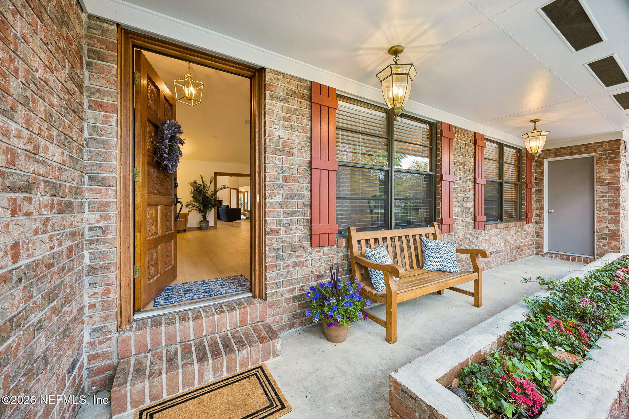 2538 Halperns Way Middleburg, FL 32068 - Photo 2 of 66 a living room with furniture and a floor to ceiling window