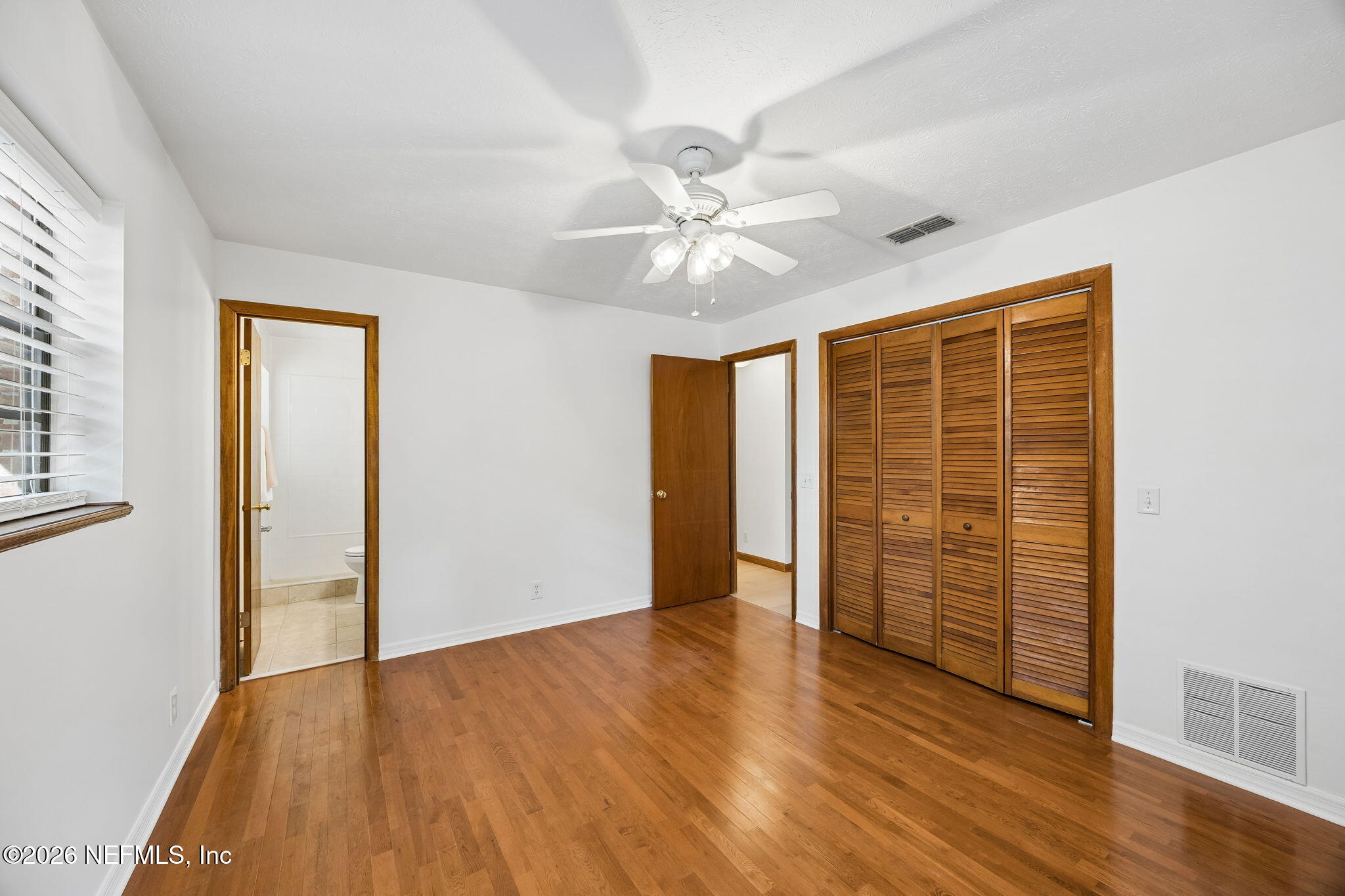 2538 Halperns Way Middleburg, FL 32068 - Photo 30 of 66 wooden floor in an empty room with a window