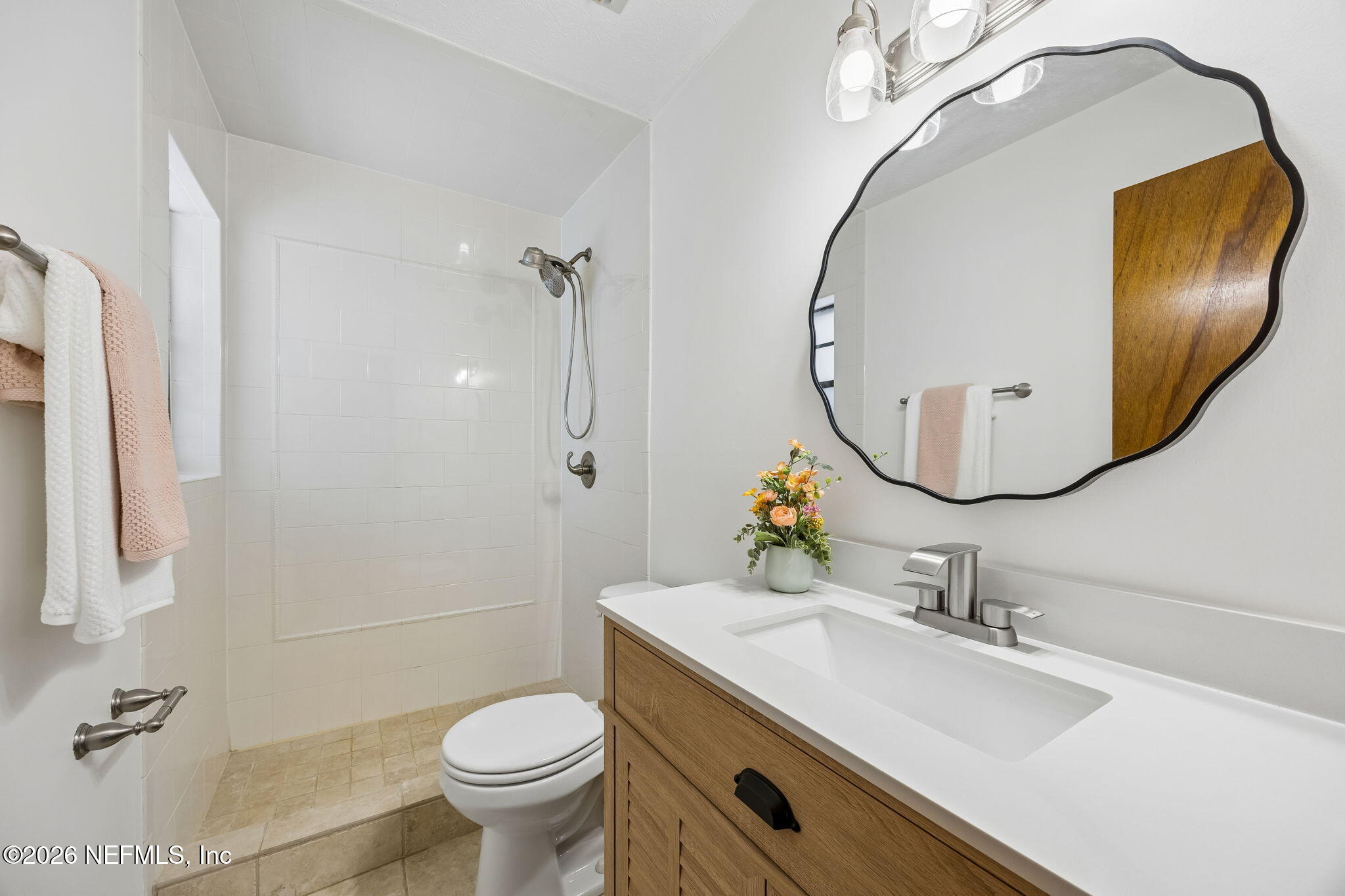 2538 Halperns Way Middleburg, FL 32068 - Photo 31 of 66 a bathroom with a sink a toilet and a mirror