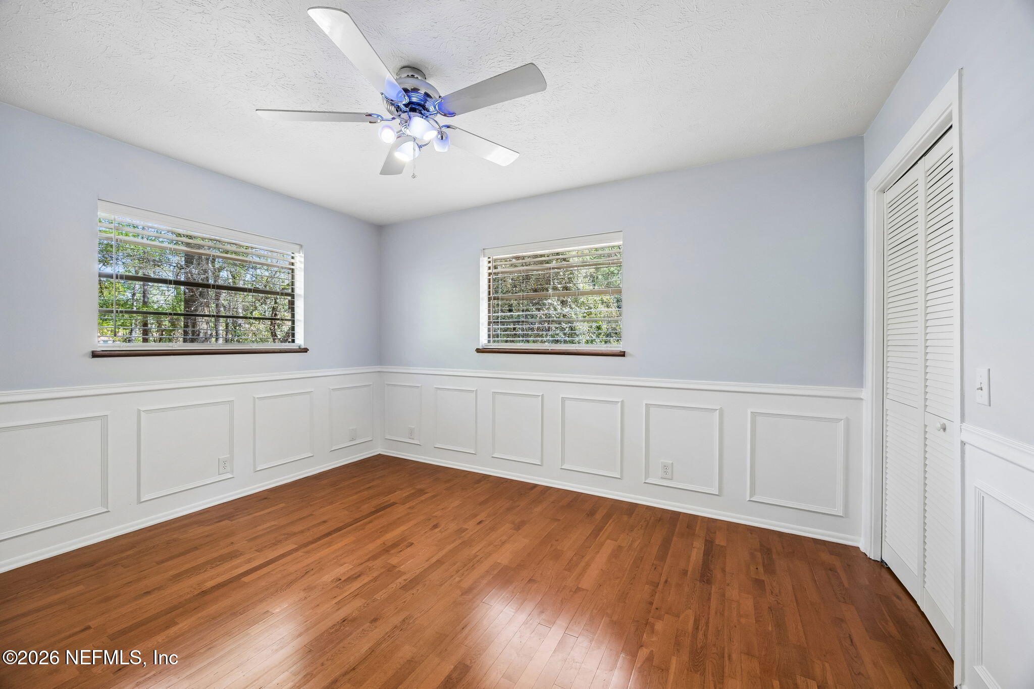 2538 Halperns Way Middleburg, FL 32068 - Photo 32 of 66 wooden floor in an empty room with a window