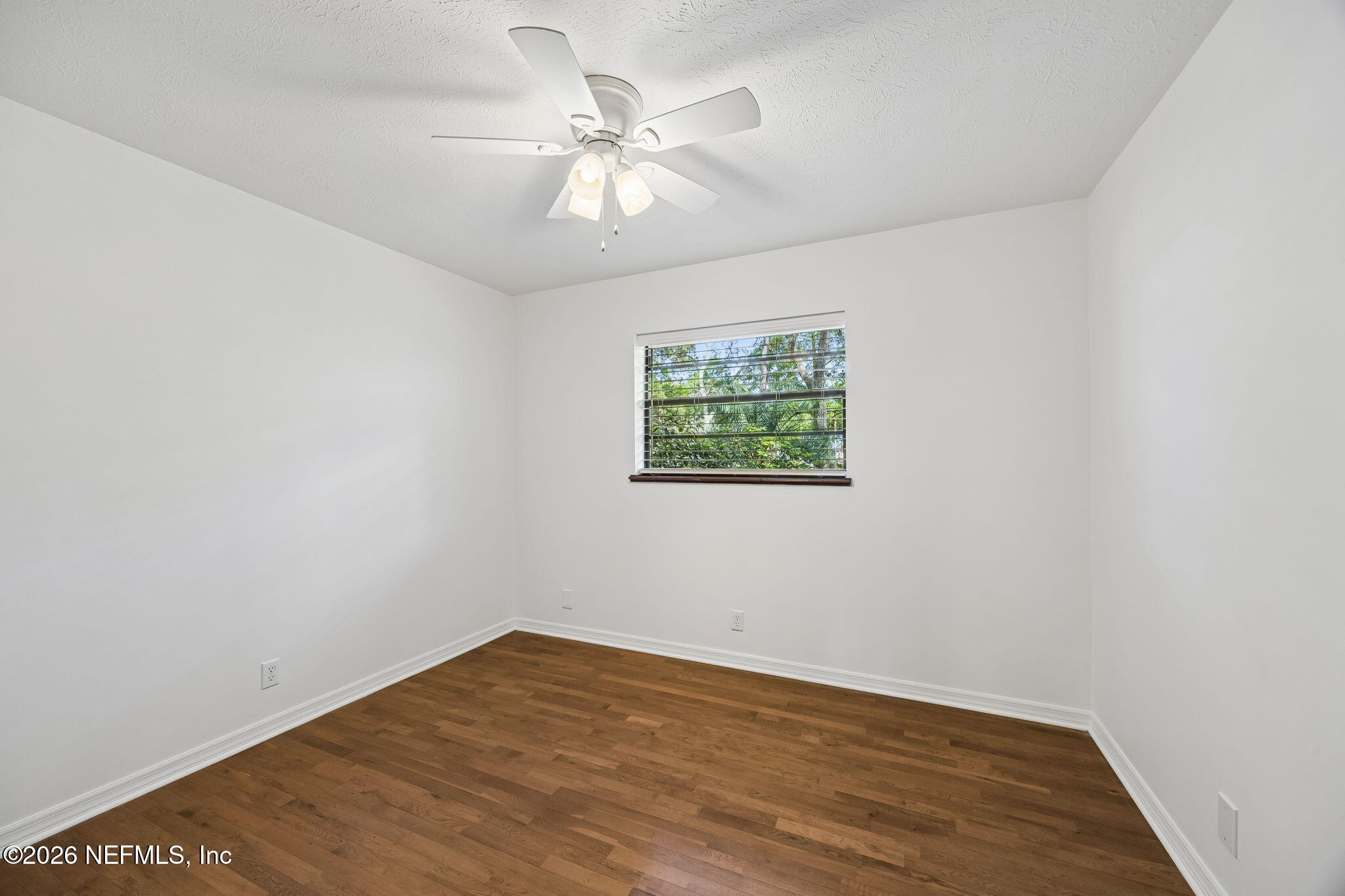 2538 Halperns Way Middleburg, FL 32068 - Photo 34 of 66 an empty room with wooden floor and ceiling fan