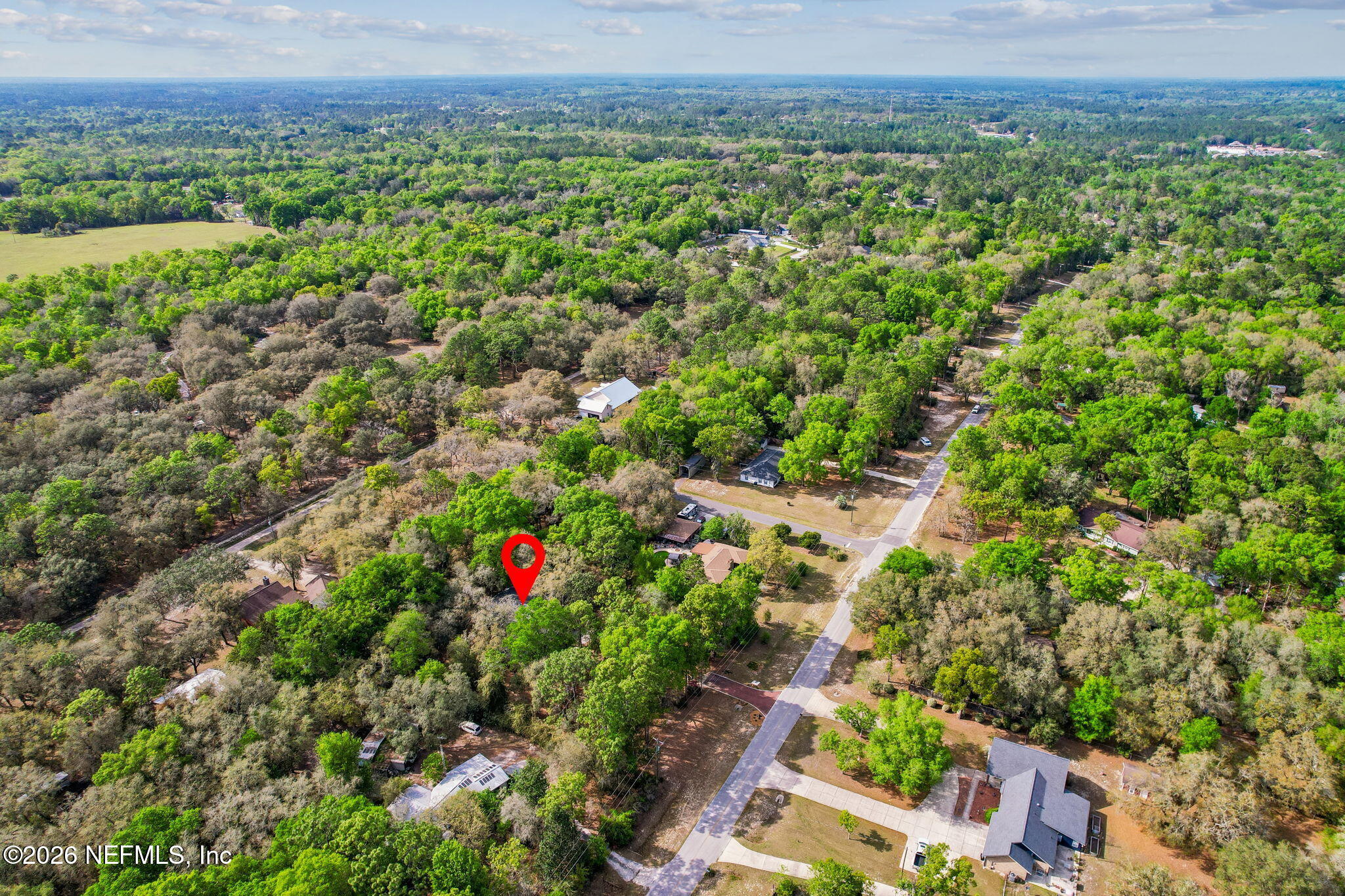 2538 Halperns Way Middleburg, FL 32068 - Photo 64 of 66 an aerial view of green landscape with trees houses and mountain view