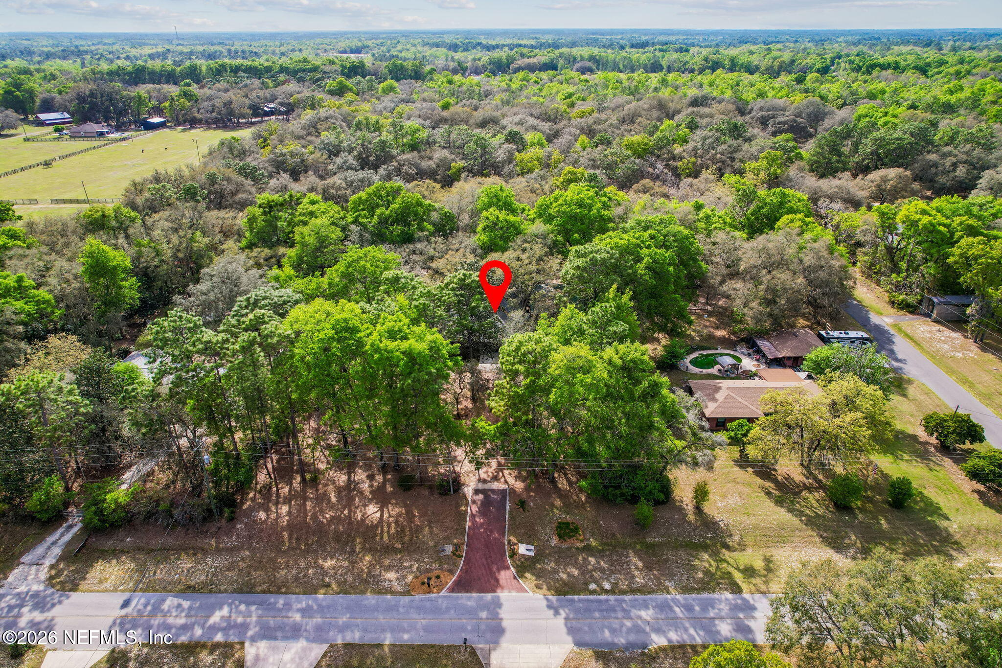 2538 Halperns Way Middleburg, FL 32068 - Photo 65 of 66 an aerial view of residential houses with outdoor space and trees