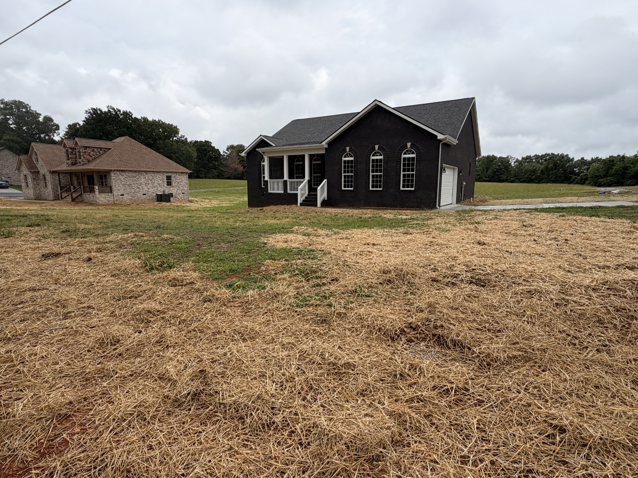 527 Old Hopkinsville Road Cadiz, KY 42211 - Photo 2 of 31 a front view of a house with a yard