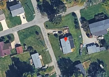an aerial view of houses with outdoor space