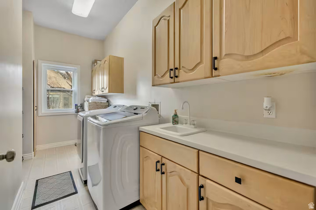 11789 Nicklaus Road Sandy, UT 84092 - Photo 45 of 58 Laundry room featuring cabinet space and independent washer and dryer