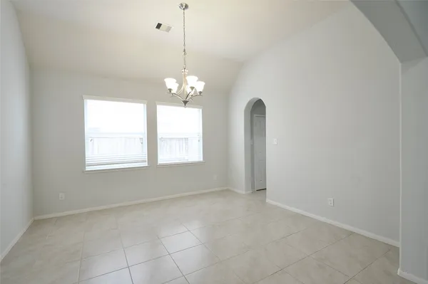 a kitchen with stainless steel appliances granite countertop a sink stove and microwave