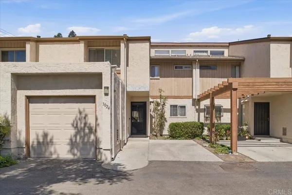 a view of a brick house with a large windows