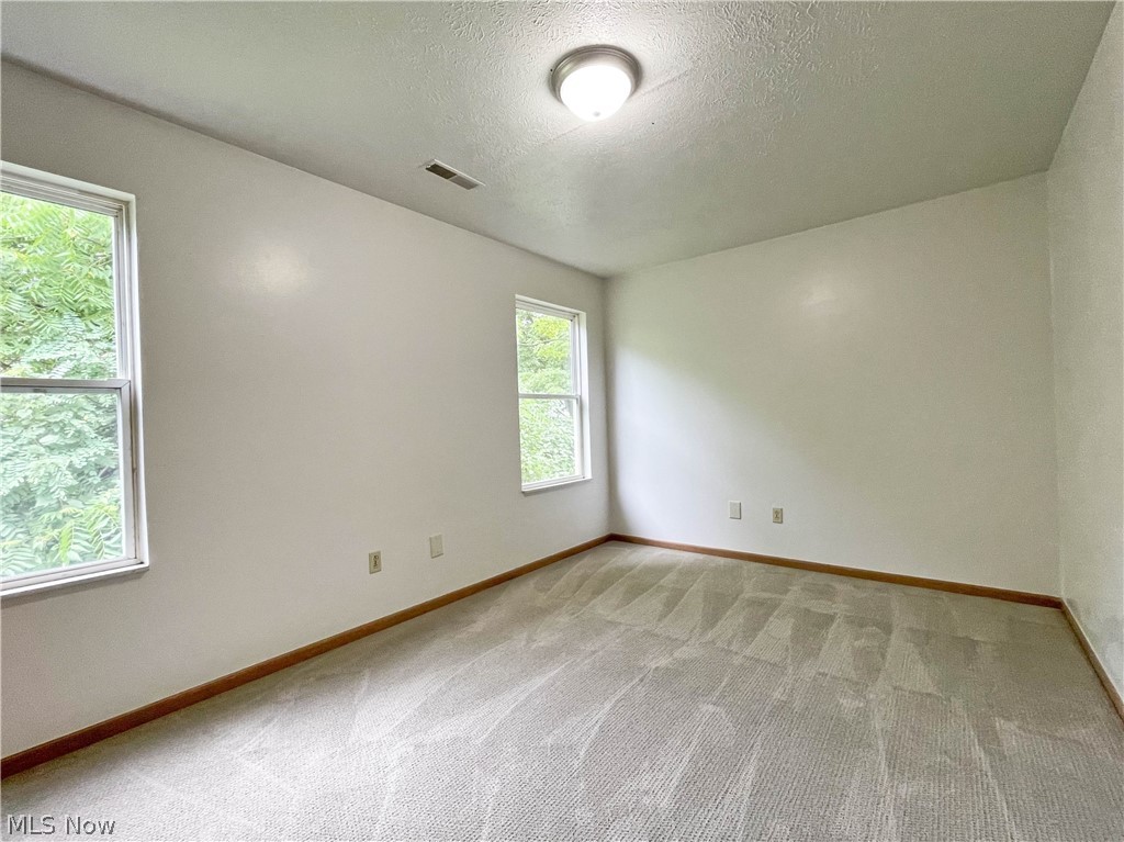 263 Reed Avenue Campbell, OH 44405 - Photo 20 of 30 Carpeted empty room featuring a textured ceiling