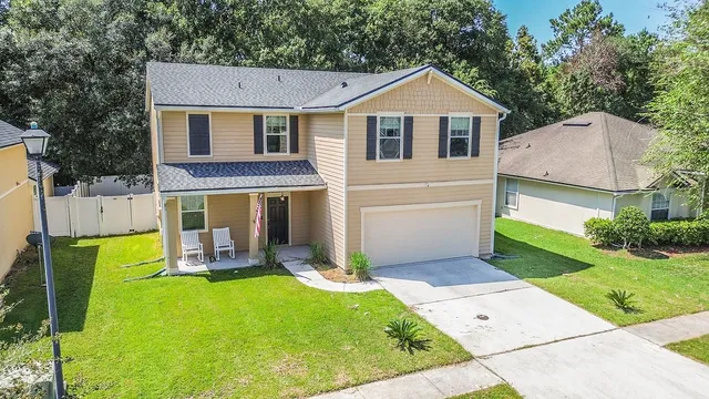 a view of an empty room with a windows