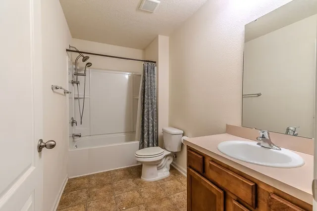 a view of a livingroom with a ceiling fan and window