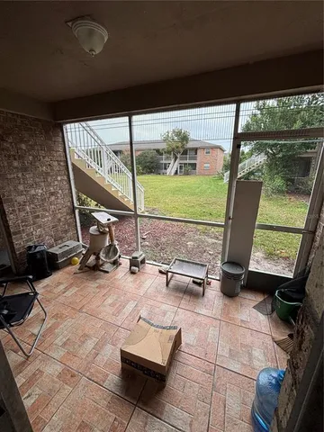 a view of a chairs and table in patio