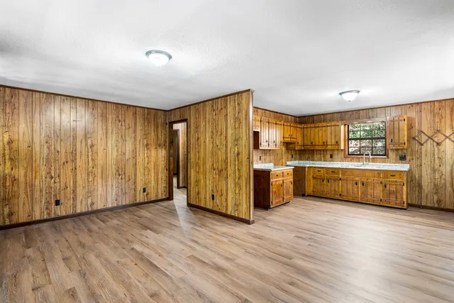 a view of a kitchen with wooden floor