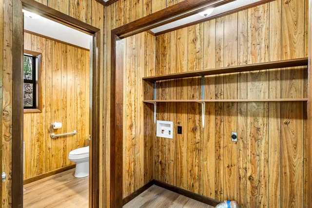 a view of a bathroom with a glass door and shower