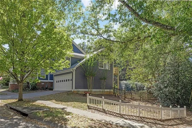 a view of a house with a tree