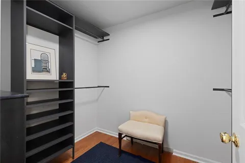 a hallway that has a couch in it