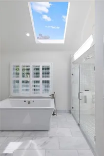 a view of empty room with a large window