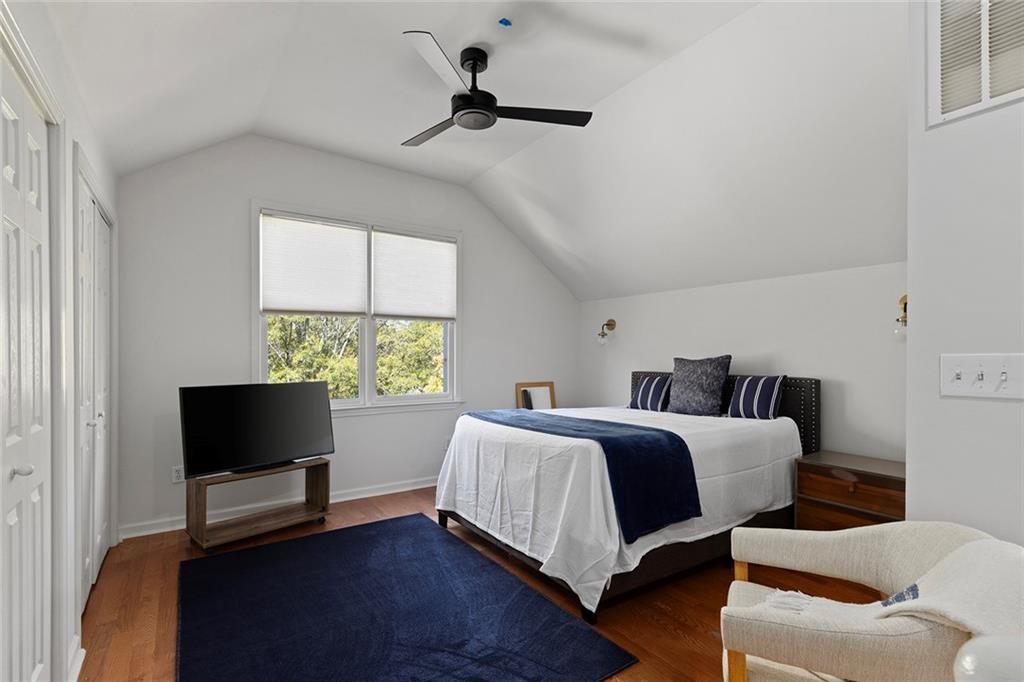 203 Ridley Lane Decatur, GA 30030 - Photo 29 of 43 a bedroom with a bed a flat screen tv and a couch