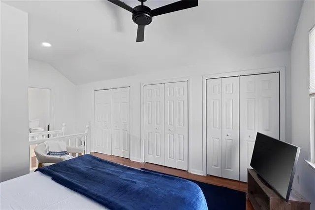 a view of a room with wooden floor and cabinet