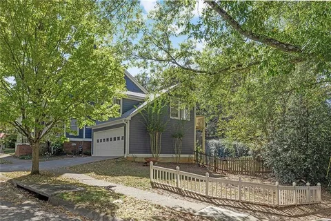 a view of a house with a tree