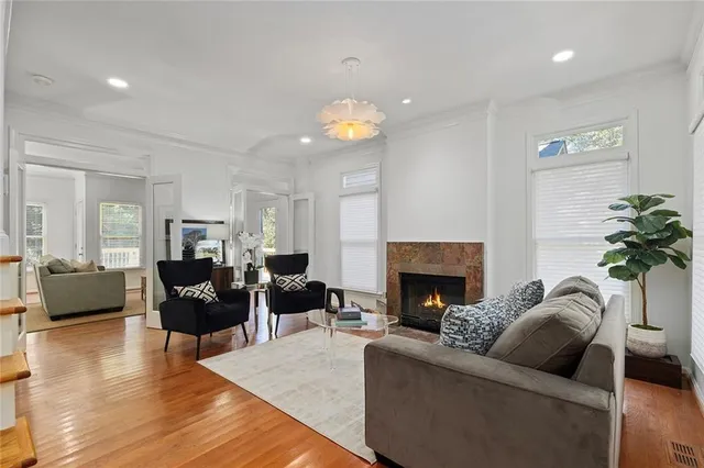 a living room with furniture fireplace and window