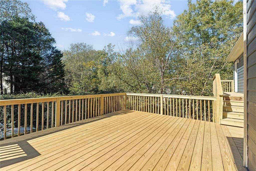 203 Ridley Lane Decatur, GA 30030 - Photo 33 of 43 a balcony with wooden floor and fence