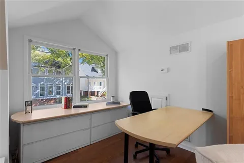 a kitchen with a table chairs and a sink