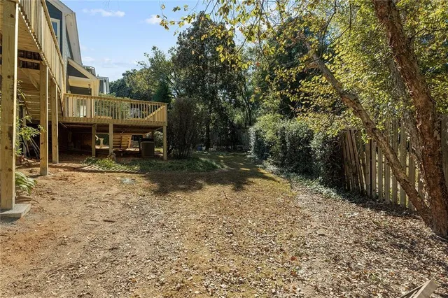a backyard of a house with barbeque oven
