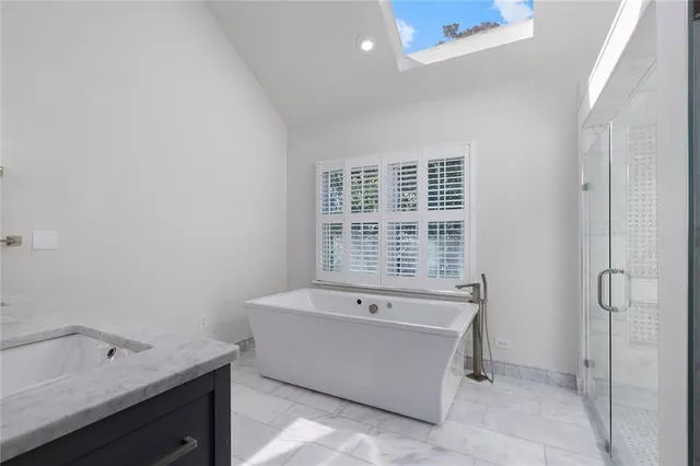 a bathroom with a bathtub and a sink