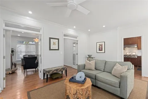 a living room with furniture or couch and a view of kitchen