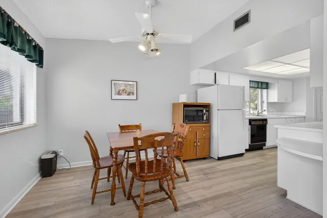 a view of a livingroom with furniture and a window