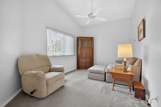 a utility room with cabinets washer and dryer