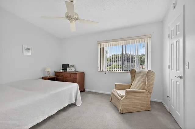 a room with a bed and cabinet