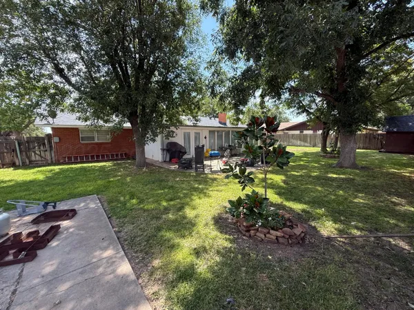 a view of a house with a yard porch and sitting area