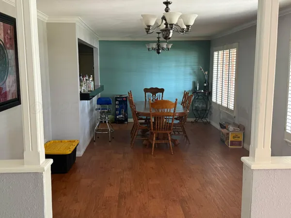 a view of a livingroom with furniture and a window