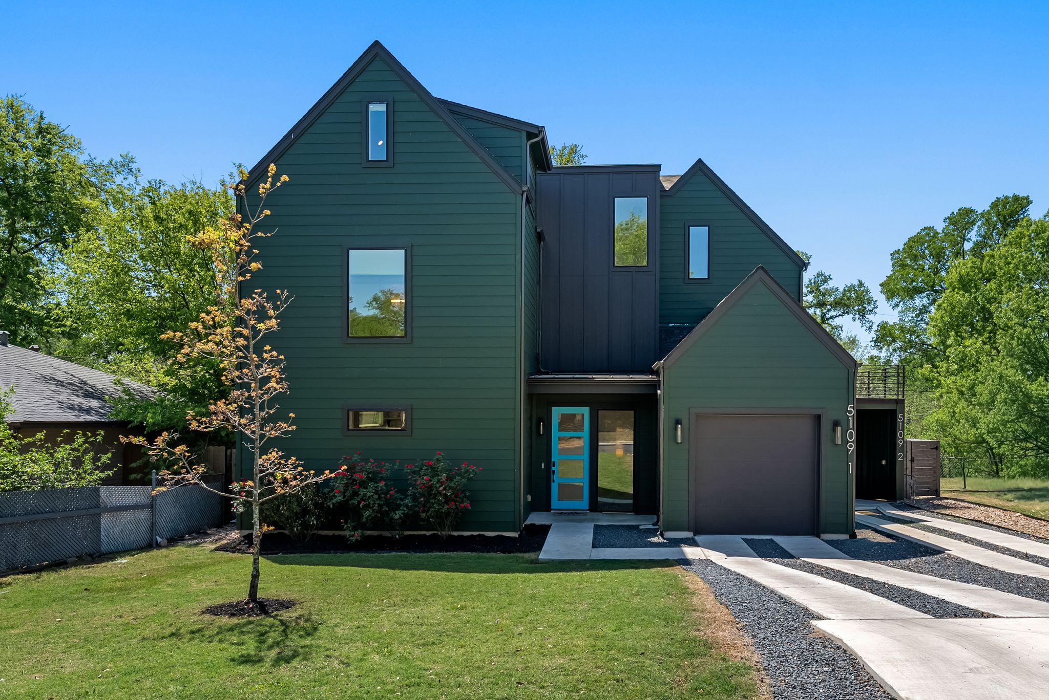 5109 Stone Gate Drive, Unit 1 Austin, TX 78721 - Photo 1 of 36 a front view of a house with a yard