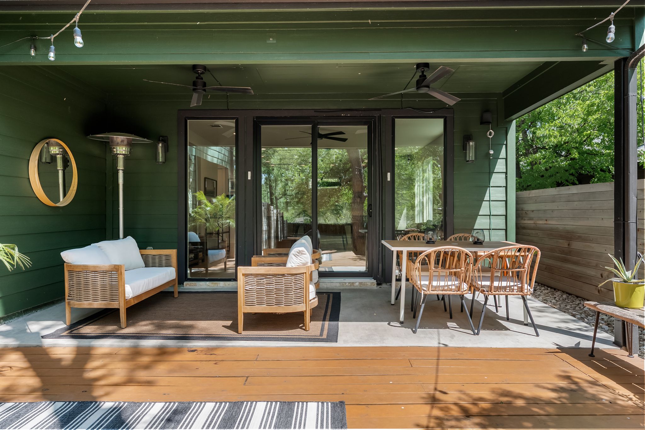 5109 Stone Gate Drive, Unit 1 Austin, TX 78721 - Photo 16 of 36 a patio with yard glass top table and chairs